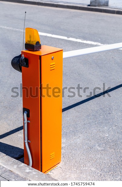 Automatic rising arm barrier for entry or\
stop traffic. Boom barrier gate acces\
entry