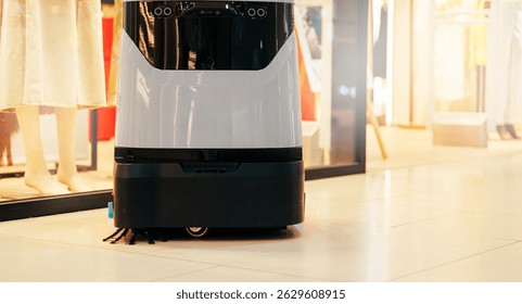 Automatic robot cleaner mopping of floor in commercial shop mall, industry machine with AI and camera.