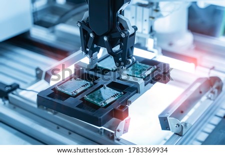 automatic robot for print circuit board (PCB)assembly machine during soldering or welding part at factory
