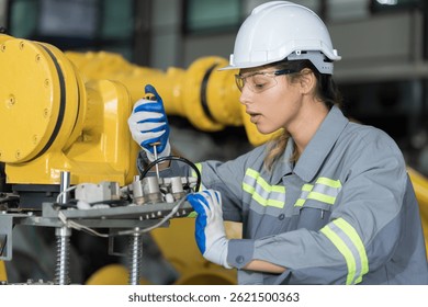 Automatic robotic arm storage warehouse. Robots arms and Warehousing. Engineer maintenance automatic robotic arm in warehouse. Technology robotics arms manufacturing industry, logistics, palletizing