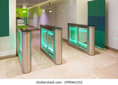 Automatic Security Gateway And Electronic Card Reader. Electronic Card Reader At Office Security Gate. Automatic Security Turnstiles With Card Reader In A Corporate Office Building