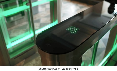 Automatic Security gateway and electronic card reader. Electronic card reader at office security gate. Automatic security turnstiles with card reader in a corporate office building - Powered by Shutterstock