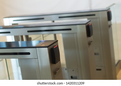 Automatic Security Turnstiles With Card Reader In A Corporate Office Building