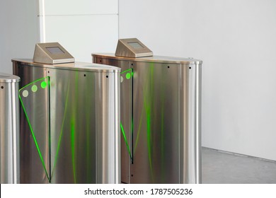 Automatic Security Turnstiles With Card Reader In A Corporate Office Building. Automatic Security Gateway And Electronic Card Reader. Electronic Card Reader At Office Security Gate.