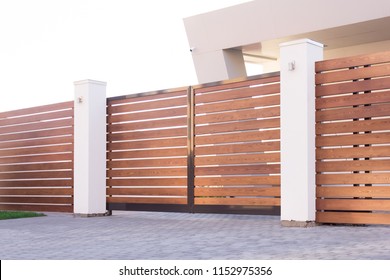 Automatic sliding gates made of wood in a private house