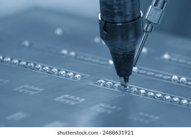 The automatic soldering machine operation with PCB board. The hi-technology electronics industry assembly process by robotic system. - Powered by Shutterstock