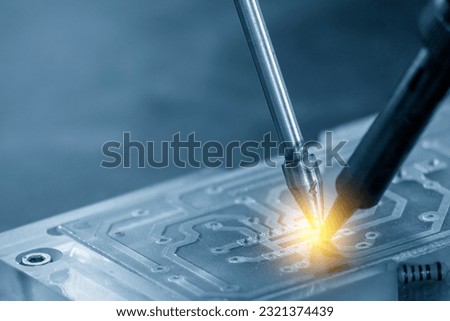 The automatic soldering machine operation with PCB board. The hi-technology electronics industry assembly process by robotic system.