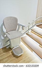 Automatic stair lift for elderly people in a house.