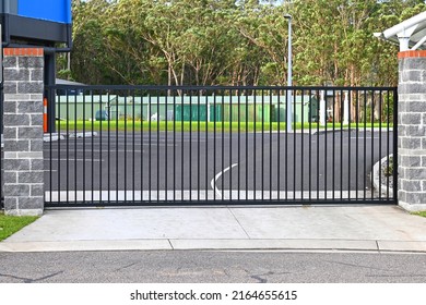 Automatic steel sliding entrance gate across a drive way