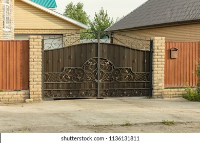 Automatic Swing Gates With Forged Elements In A Private House