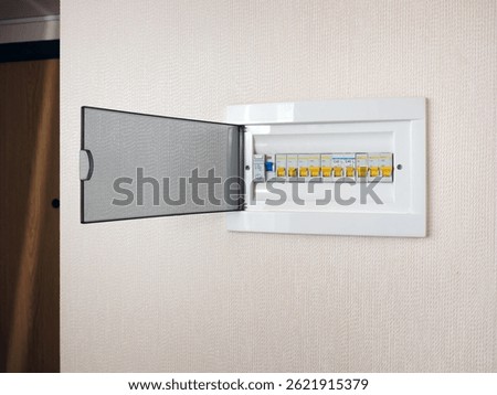 Automatic switches lined up on a distribution panel in an apartment or house. Modern safety technologies.