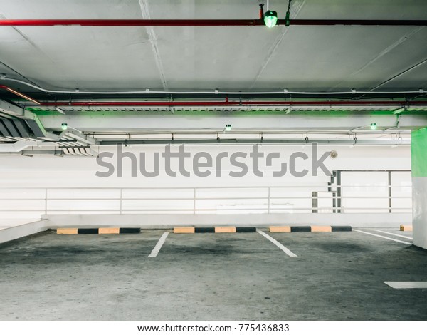 automatic\
technology check for empty area of car parking lane in shopping\
mall with red fire extinguisher no the\
wall