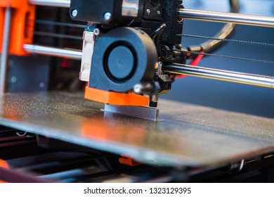 Automatic three dimensional 3d printer performs product creation. Modern 3D printing or additive manufacturing and robotic automation technology