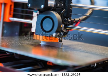 Automatic three dimensional 3d printer performs product creation. Modern 3D printing or additive manufacturing and robotic automation technology