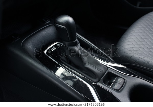 Automatic transmission gearshift stick,\
Closeup a manual shift of modern car gear shifter. Close up of the\
automatic gearbox lever, black interior\
car.