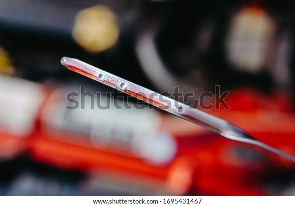 automatic transmission oil dipstick\
  gearboxes of a\
car. red oil
