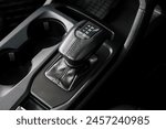 automatic transmission shift selector in the car interior. Closeup a manual shift of modern car gear shifter. 4x4 gear shift	