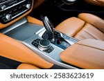 automatic transmission shift selector in the car interior. Closeup a manual shift of modern car gear shifter. 4x4 gear shift.