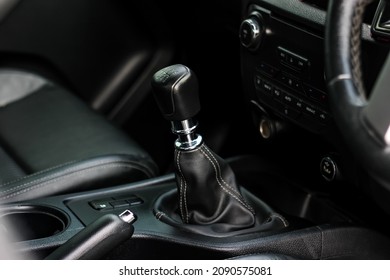 automatic transmission shift selector in the car interior. Closeup a manual shift of modern car gear shifter. - Shutterstock ID 2090575081