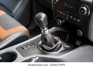 automatic transmission shift selector in the car interior. Closeup a manual shift of modern car gear shifter. 4x4 gear shift