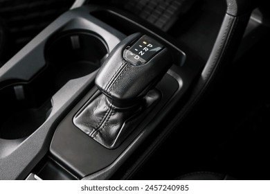 automatic transmission shift selector in the car interior. Closeup a manual shift of modern car gear shifter. 4x4 gear shift	