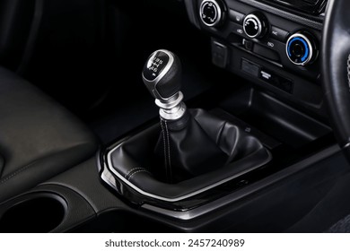 automatic transmission shift selector in the car interior. Closeup a manual shift of modern car gear shifter. 4x4 gear shift	 - Powered by Shutterstock