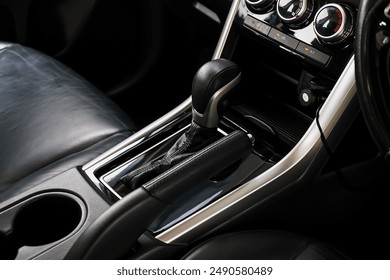 automatic transmission shift selector in the car interior. Closeup a manual shift of modern car gear shifter. 4x4 gear shift
