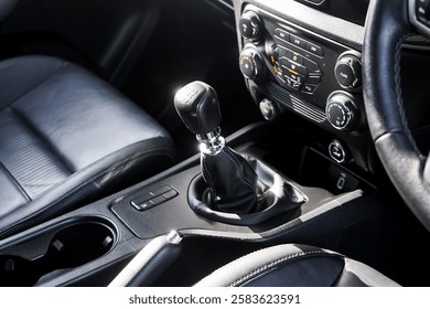 automatic transmission shift selector in the car interior. Closeup a manual shift of modern car gear shifter. 4x4 gear shift.