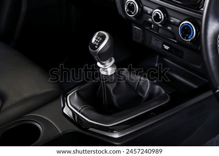 automatic transmission shift selector in the car interior. Closeup a manual shift of modern car gear shifter. 4x4 gear shift	