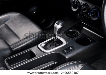 automatic transmission shift selector in the car interior. Closeup a manual shift of modern car gear shifter. 4x4 gear shift