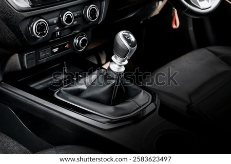 automatic transmission shift selector in the car interior. Closeup a manual shift of modern car gear shifter. 4x4 gear shift.