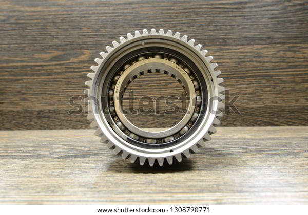 Automatic\
transmission spare part on wooden\
background