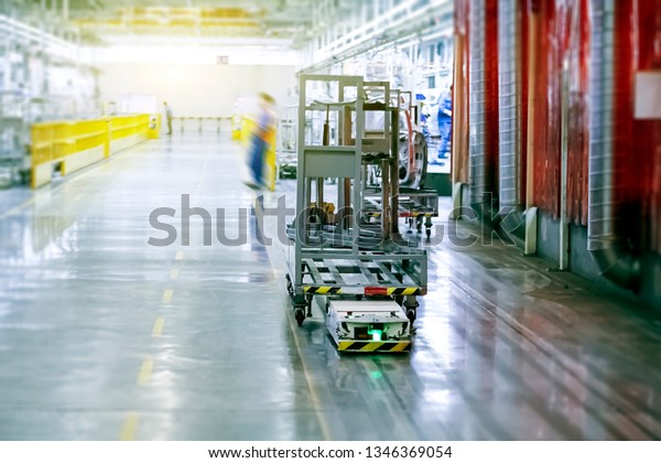 Automatic transport material truck in automobile\
manufacturing plant