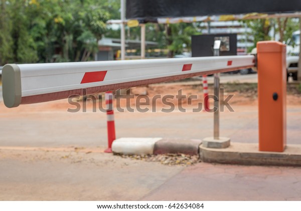 Automatic vehicle security gate barrier on the\
outdoor car parking.