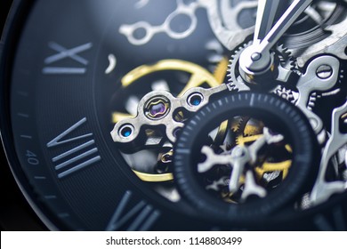 Automatic watch machinery macro detail - closeup luxury automatic wristwatch for men, stainless steel bracelet, with lens flare. - Powered by Shutterstock