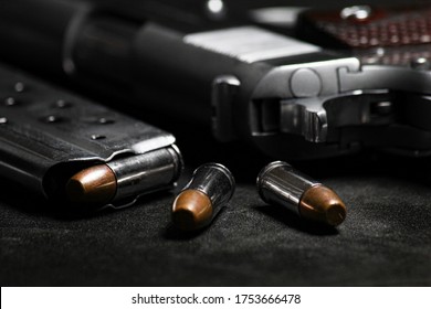 Automatic white gun stainless steel pistol weapon model m1911 with real bullet ammo in magazine with black background