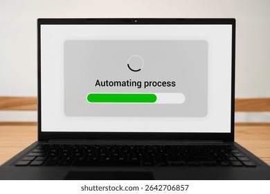 Automating process workflow. Laptop screen with green progress bar.