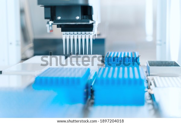 Automation in\
the clinical laboratory. Pipetting robot laboratory. Medicine\
robotics. Research and science\
background.