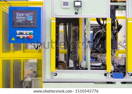 Automation concept: View of operation panel on automation machine's fence in manufacturing plant