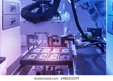 Automation of machine assembly of computer circuit chip with robot arm,Smart factory industry 4.0 concept.