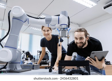 automation machine engineer students study and inspection control robot arm machine in robotics engineering academy at university or factory workshop. AI robot technology, future innovation trend. - Powered by Shutterstock