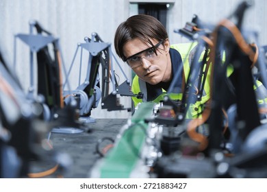 automation machine engineer students study and inspection control robot arm machine in robotics engineering academy at university or factory workshop. AI robot technology, future innovation trend.