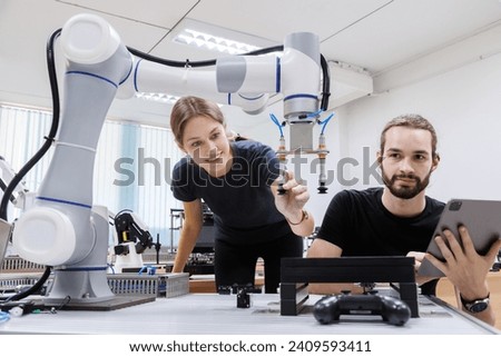 automation machine engineer students study and inspection control robot arm machine in robotics engineering academy at university or factory workshop. AI robot technology, future innovation trend.