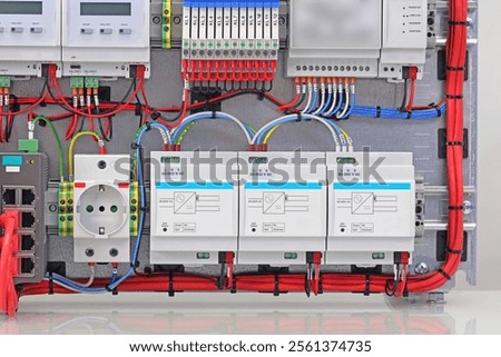 Automation modules controlled via a digital data bus. It is installed in an electric switchboard. Soft focus.