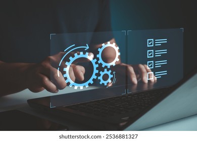 Automation Software Technology Process System Business Concept. AI industrial process workflow optimisation, checklist. Robotic process automation concept with person using laptop on virtual screen. - Powered by Shutterstock