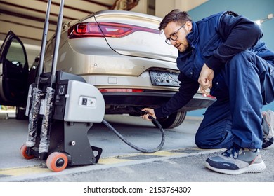 An Auto-mechanic Checking On Car Exhaust Gases On Technical Service.