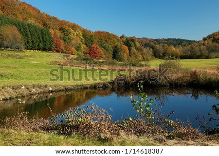 automn colors and waterreflection landscape in France