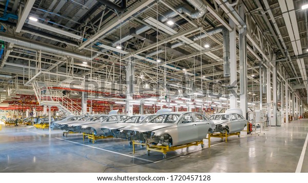 Automobile assembly line production.Car factory.\
Car parts. Engine\
factory.