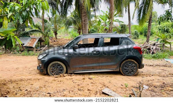Automobile car insurance stuck in mud , Susuki\
swift , 3 May 2022 , Buriram\
province.