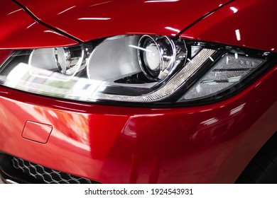 automobile detailing service. protective film on the headlight of the car. Headlights. Glass coating